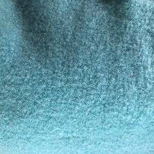 Building supplies: Light teal wool vest