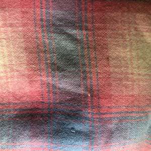 Building supplies: Blues, pinks and white tartan wool vest