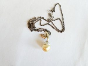 Jewellery: Acorn necklace with 11mm gold South Sea pearl. silver, and 9ct rose gold. Length 46cm