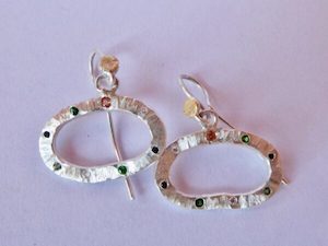 Going Dotty earrings. silver, tsavorite garnets, sapphire, black and white diamonds