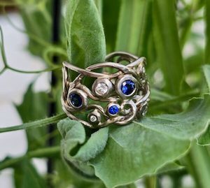 Vine ring. white gold pale platinum mix, diamonds and Ceylon sapphires. Size 0