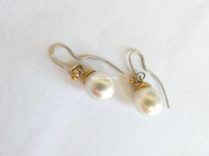 White South Sea pearl earrings with pink tinge. Pearl length 12mm. silver and 24ct gold