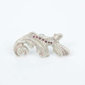 VM120: Sand cast scroll brooch