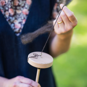 Drop spindle spinning (Ōtautahi)