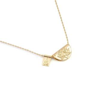 Clothing: BY CHARLOTTE GOLD LOTUS LITTLE BUDDHA NECKLACE