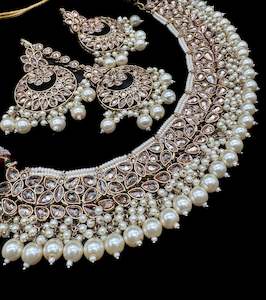 Jewellery: Golden Original Polki stone with pearls beaded heavy work necklace with earrings and tikka set