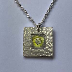 Pendant, yellow and grey koru