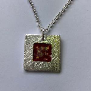 pendant, hammered fine silver with red enamel and fine gold detail