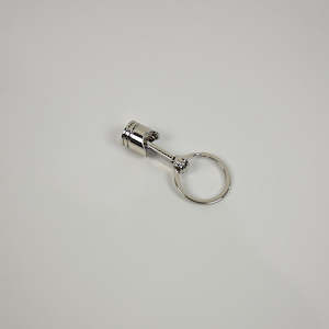 Motor vehicle part dealing - used: Piston Keychain