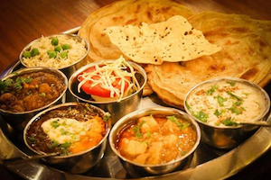 Amritsari Thali (1pc Amritsari Kulcha, Channa Masala, Aloo Sabzi, Dal Makhani, R…