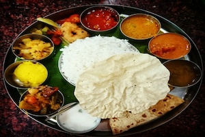 Restaurant: South Thali (Bhindi Fry, Cabbage Sabzi, Sambhar, 4pc Puri, Rice, Curd, Papad, Pickle & Sweet)