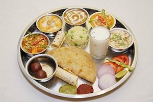 Restaurant: Punjabi Thali (Shahi Paneer, Sabzi of the day, Dal Makhani, Rice, 1pc Naan, Raita, Salad, Pickle, Papad & Sweet)