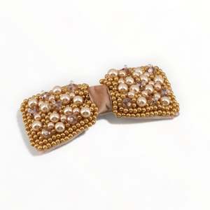 Clothing accessory: The Adelpha Bow Designer Pearl Hair Clip