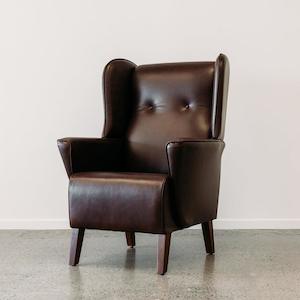 Furniture: Lily winged leather armchair in settler serge