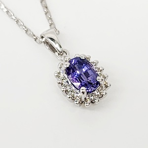 9ct White Gold 1.06ct Ceylon Sapphire with 0.10ct Diamond Halo Pendant