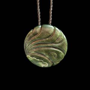 Hand carved Jade disc pendant with korus by Nick and Mady