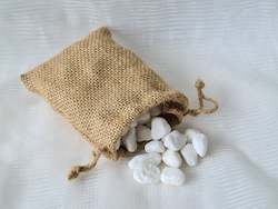 Homewares: Decorative white stones in a drawstring gunny bag.