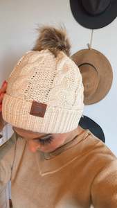 Womenswear: Beige pom pom beanie