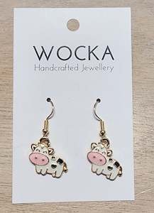 Clothing: White Cow Earrings