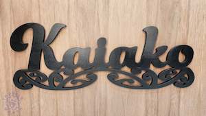 Kaiako sign carved of wood