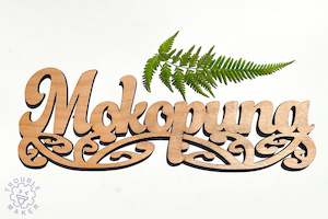 Mokopuna sign art, carved of wood