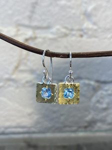 silver and 22 carat gold earrings with blue topaz