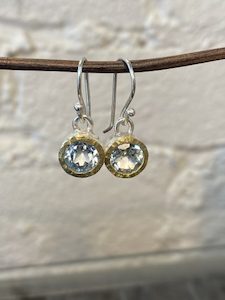 silver and 22 carat gold earrings with blue topaz