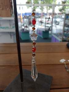 Store-based retail: Orange and gold Point Sun Catcher